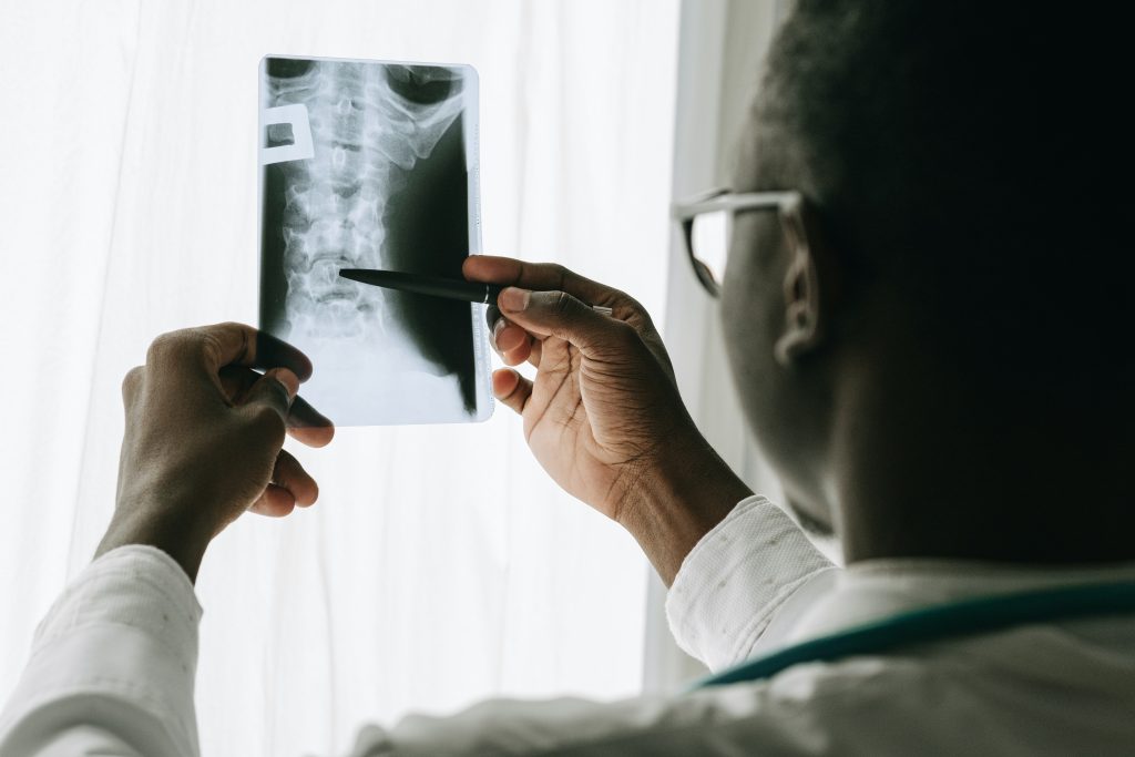 radiologist looking at an x-ray